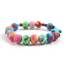 Load image into Gallery viewer, Floral Softened Clay Bead Cross Bracelet
